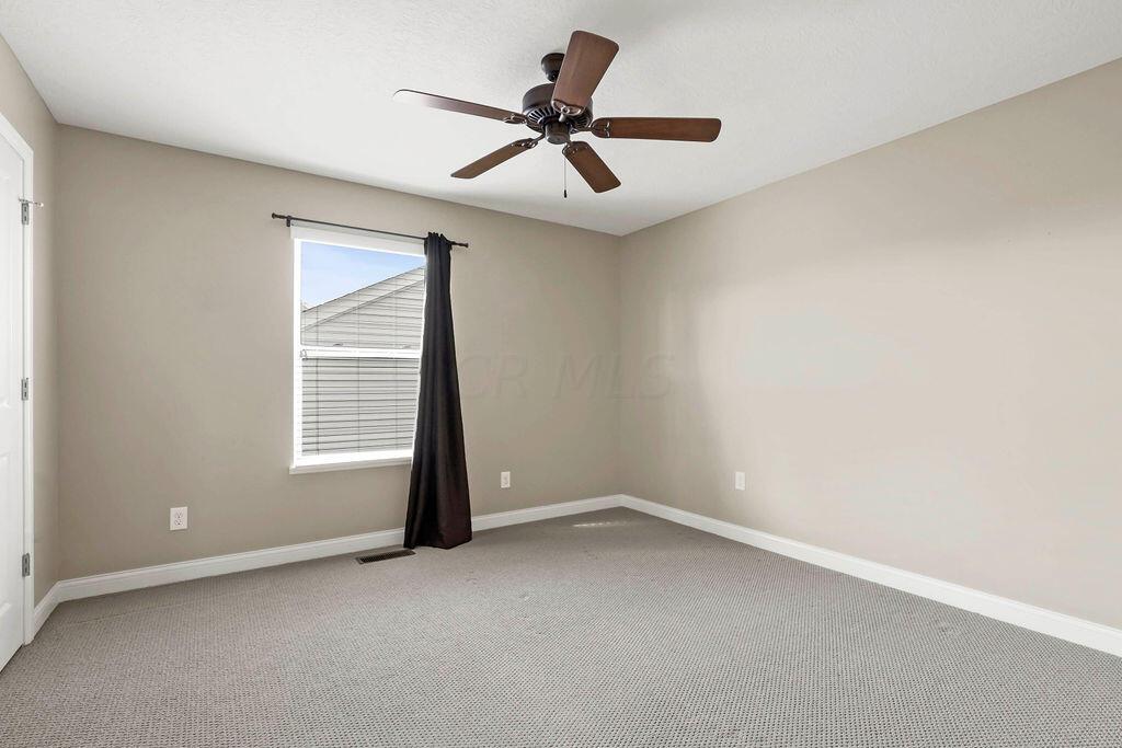 6163 Jennis Road Westerville, OH 43081 - Photo 34 of 44 • Tan carpet
• Tan painted walls
• Ceiling fan
• 2” blinds