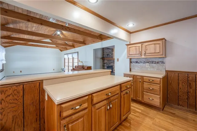 a kitchen with sink cabinets and wooden floor