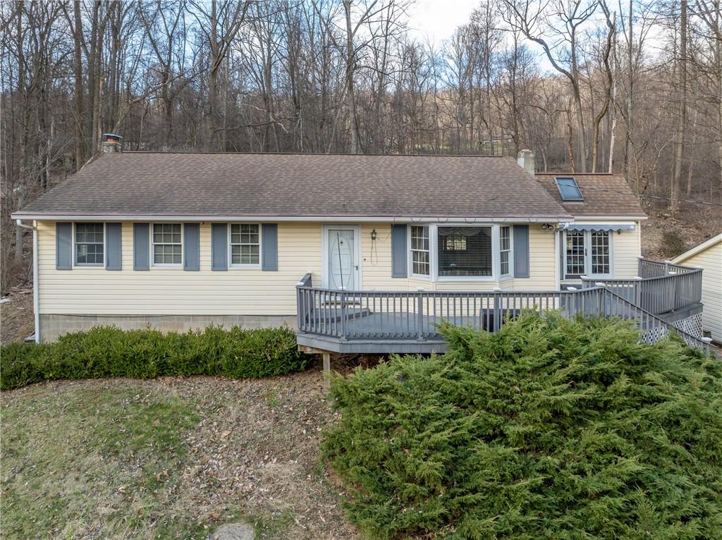 4416 Highway 819 Avonmore, PA 15618 - Photo 3 of 46 a view of a house with a small yard and large trees