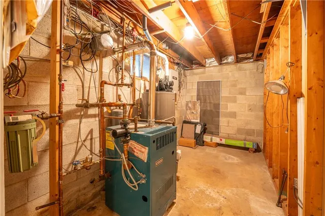 a bathroom with a granite countertop sink and shower