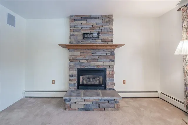 an empty room with a fireplace