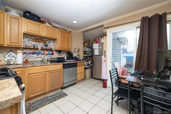 a kitchen with a sink appliances and cabinets