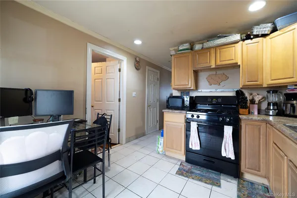 a kitchen with stainless steel appliances a stove a sink and a refrigerator