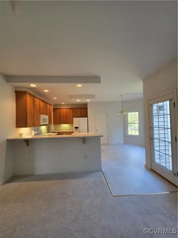 a living room with furniture a lamp and a fireplace