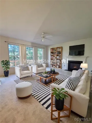 an empty room with windows and ceiling fan view