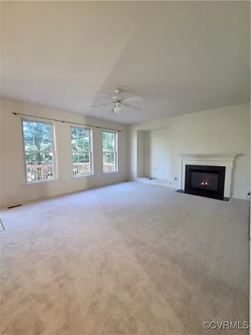 a bedroom with a large bed and a couch