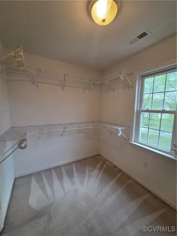 a bedroom with bed and a couch