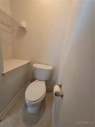 a bathroom with a sink a toilet and window