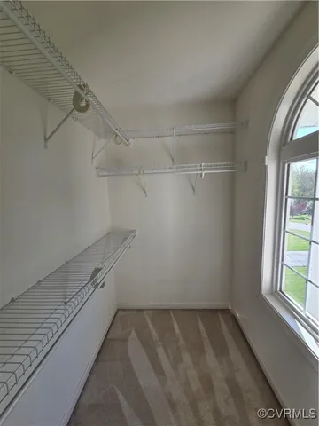 a front view of a house with large windows