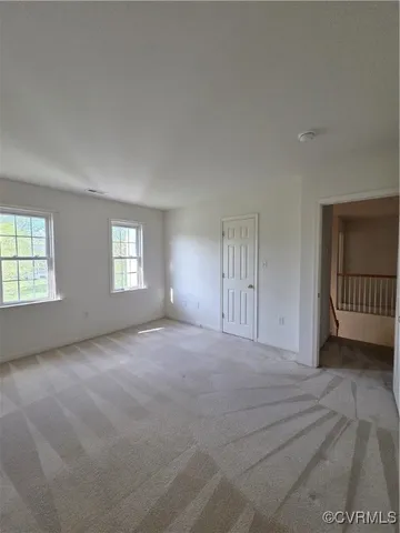 a view of balcony with wooden floor