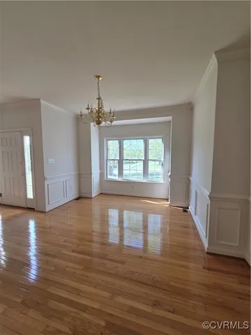 a view of an empty room with windows