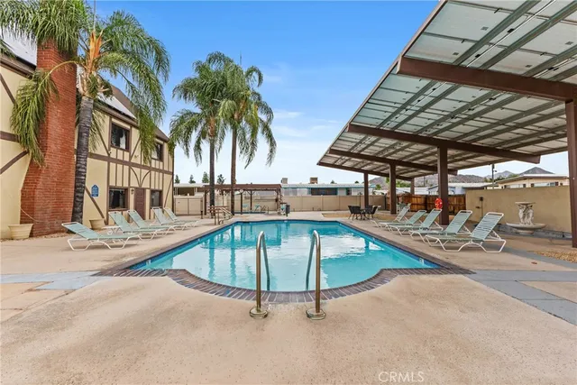 a building outdoor space with patio furniture and potted plants