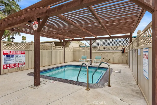 a view of a gym room with lots of gym equipment