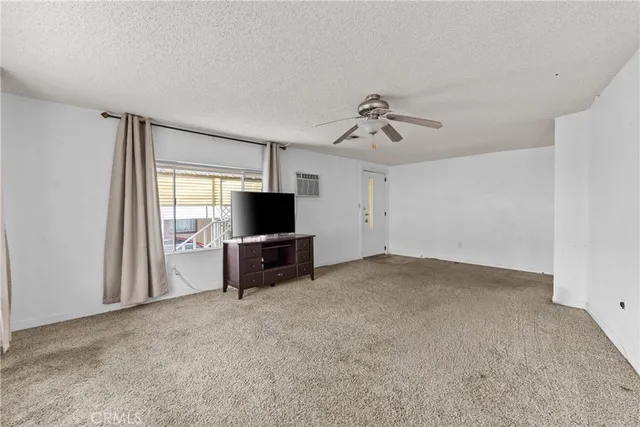 a view of a livingroom with furniture and an entryway