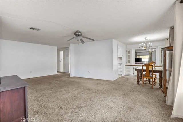 a view of a dining room with furniture and window