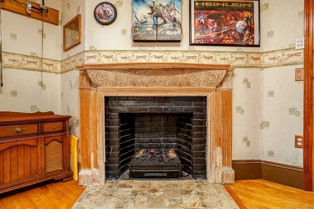a front view of a fireplace with cabinet