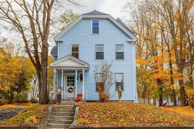 a front view of a house with a yard