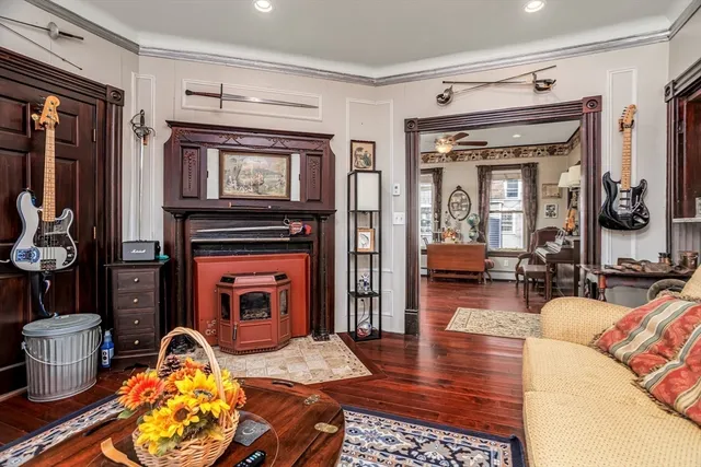 a living room with furniture and a fireplace