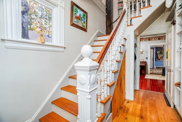 a view of staircase with a rug