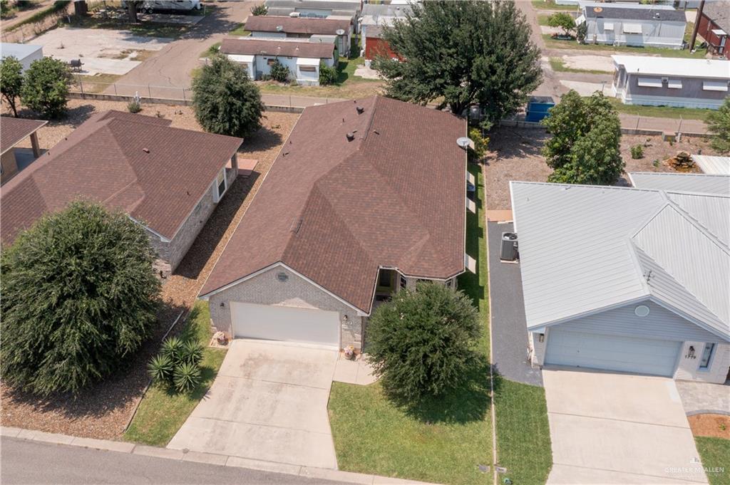 1717 Sun Street Mission, TX 78572 - Photo 16 of 19 an aerial view of a house with a yard and a garage