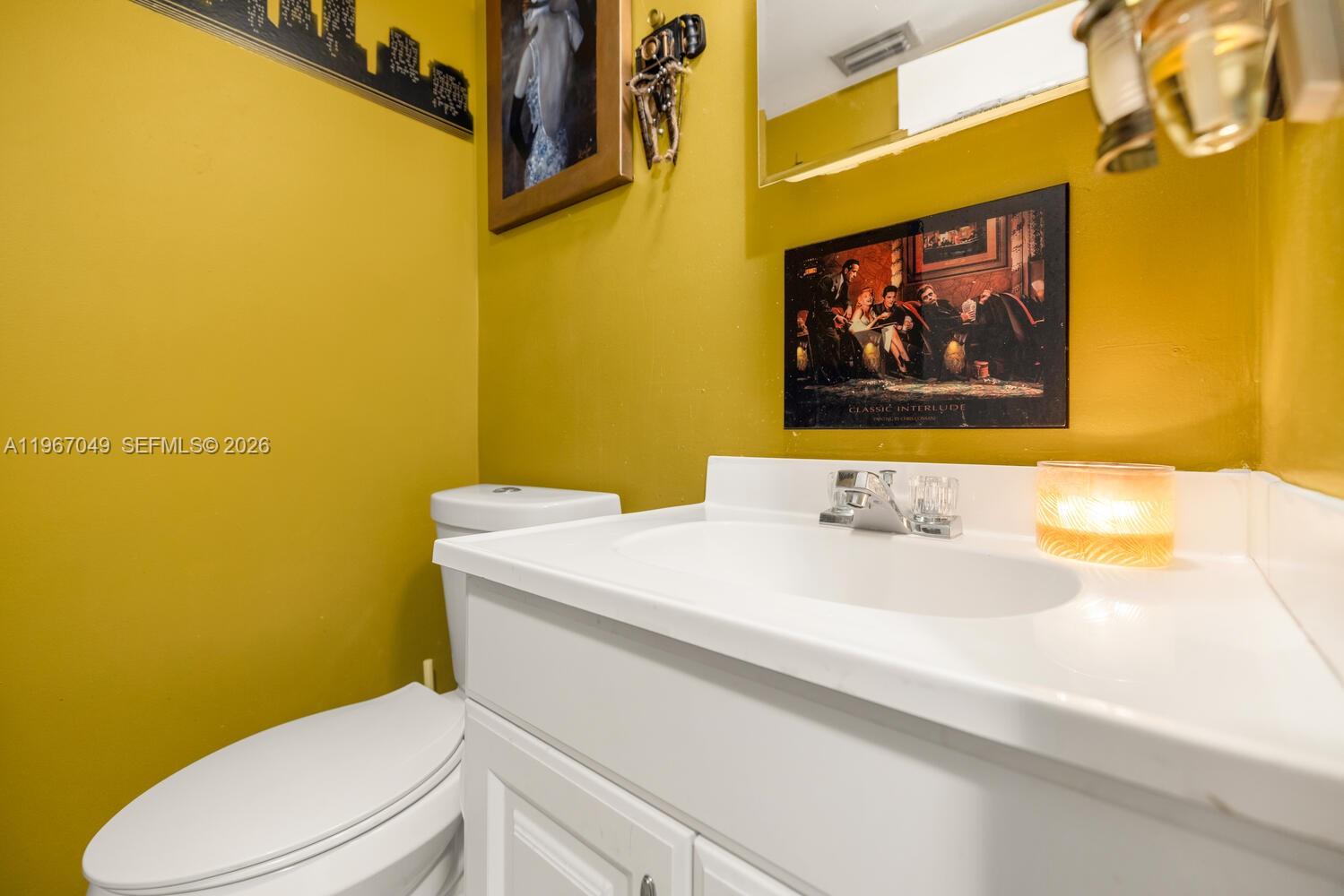 7785 Southwest 86th Street, Unit E119 Miami, FL 33143 - Photo 15 of 33 a bathroom with a sink and a toilet