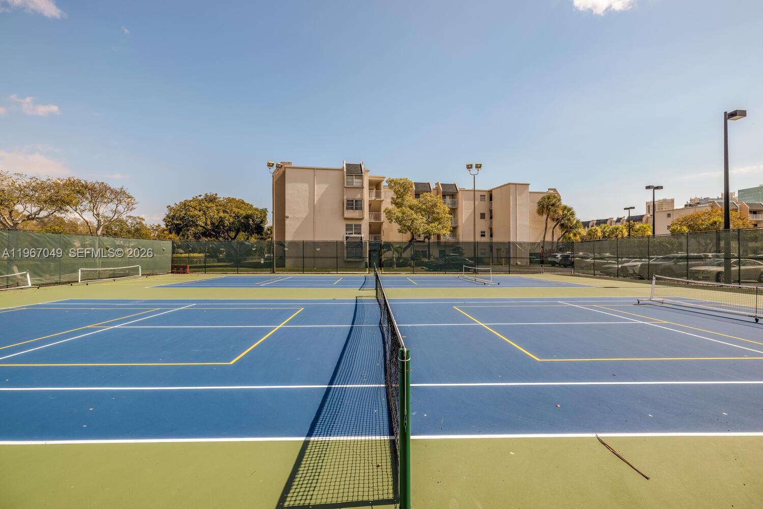 7785 Southwest 86th Street, Unit E119 Miami, FL 33143 - Photo 23 of 33 a view of a tennis court
