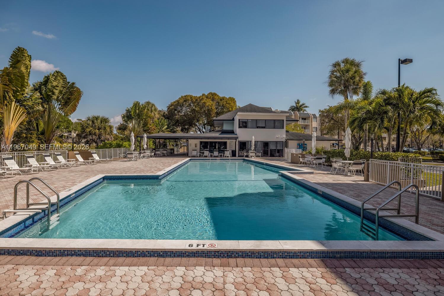 7785 Southwest 86th Street, Unit E119 Miami, FL 33143 - Photo 25 of 33 a view of a swimming pool with a patio