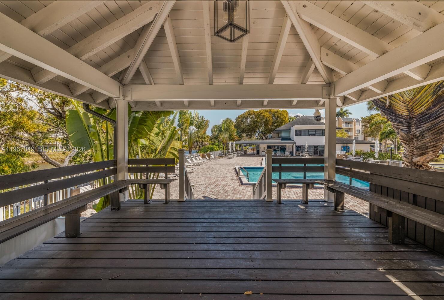 7785 Southwest 86th Street, Unit E119 Miami, FL 33143 - Photo 28 of 33 a view of a chairs and table in patio