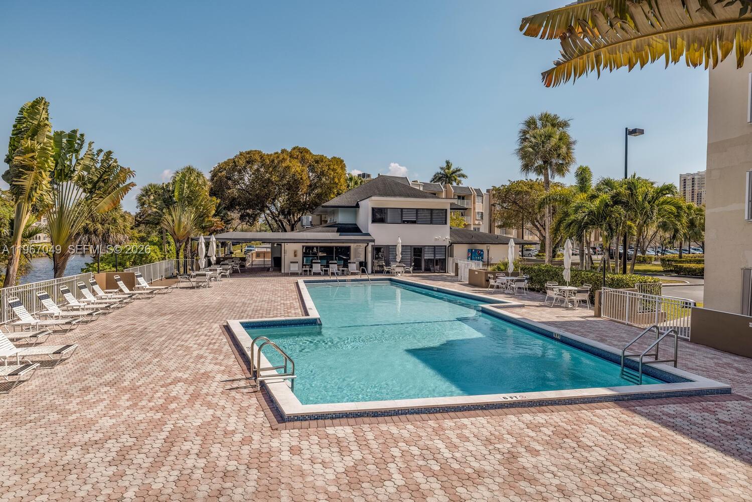 7785 Southwest 86th Street, Unit E119 Miami, FL 33143 - Photo 29 of 33 swimming pool view with a outdoor seating