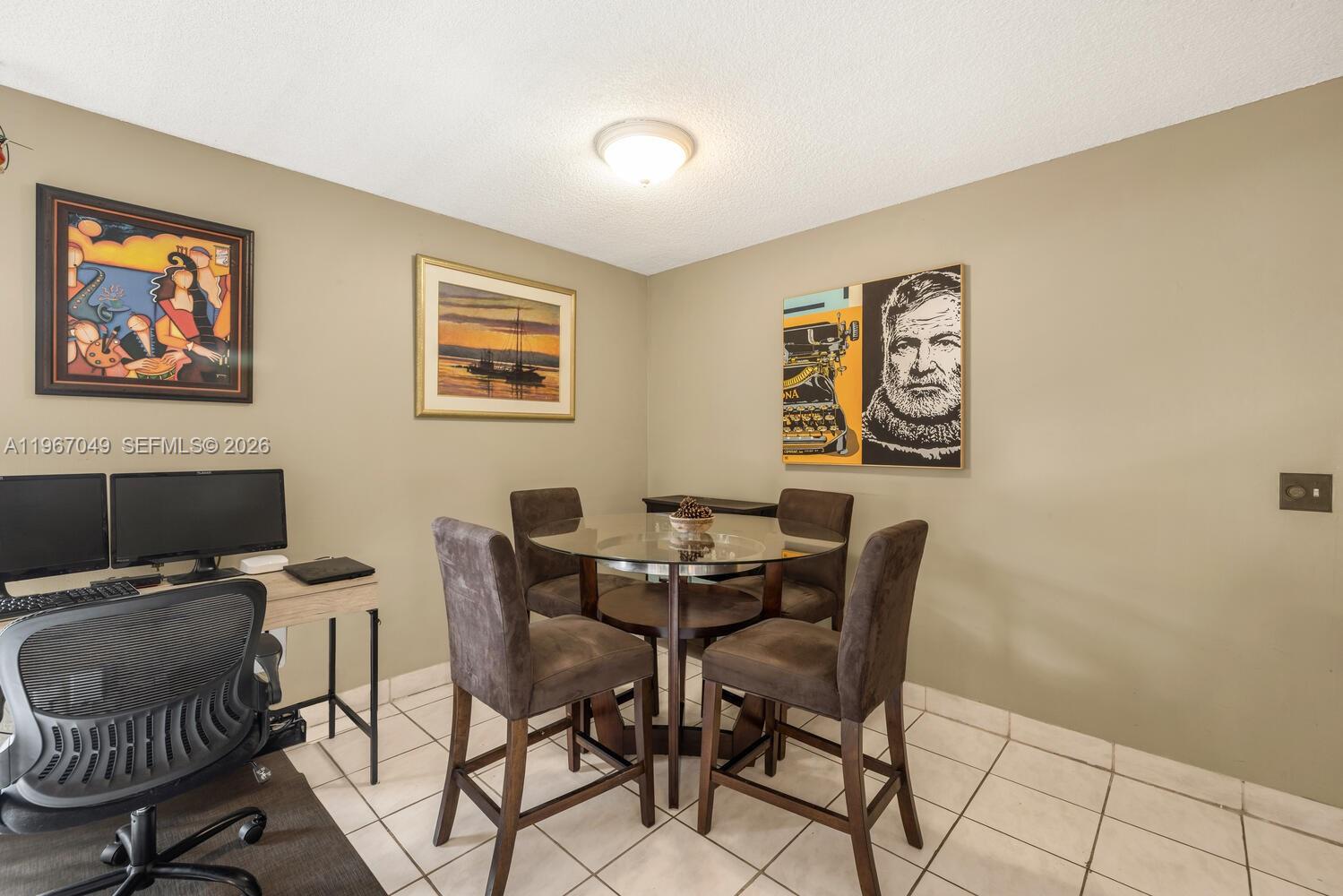 7785 Southwest 86th Street, Unit E119 Miami, FL 33143 - Photo 4 of 33 a view of a workspace with furniture