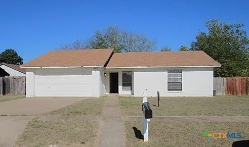 a house with trees in the background