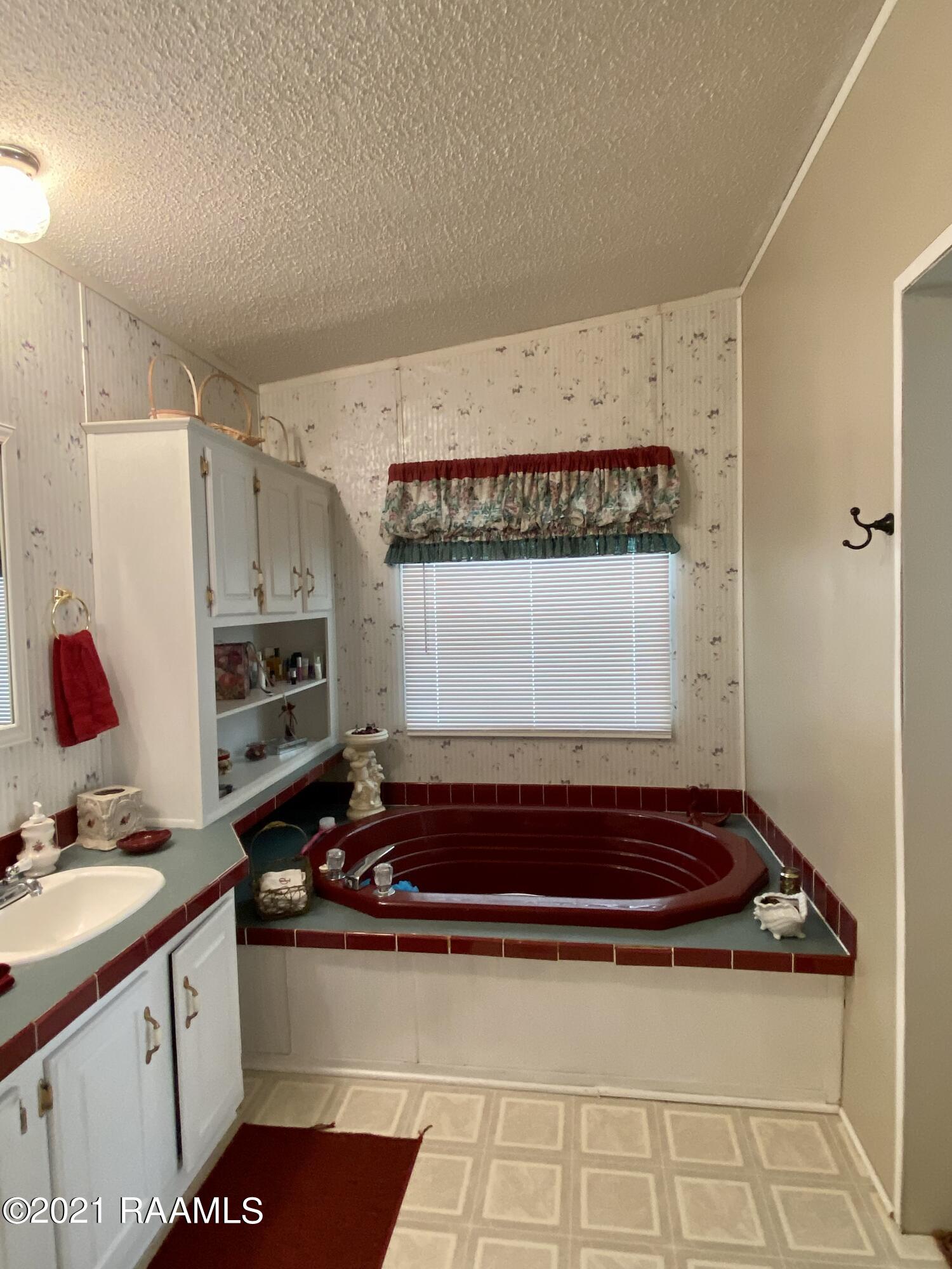 11308 Wesley Road Abbeville, LA 70510 - Photo 14 of 24 Garden tub in master bathroom
