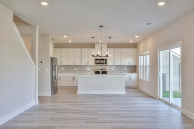 a view of kitchen with wooden floor