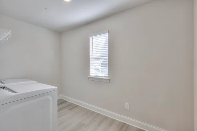 a utility room with a window dryer and washer