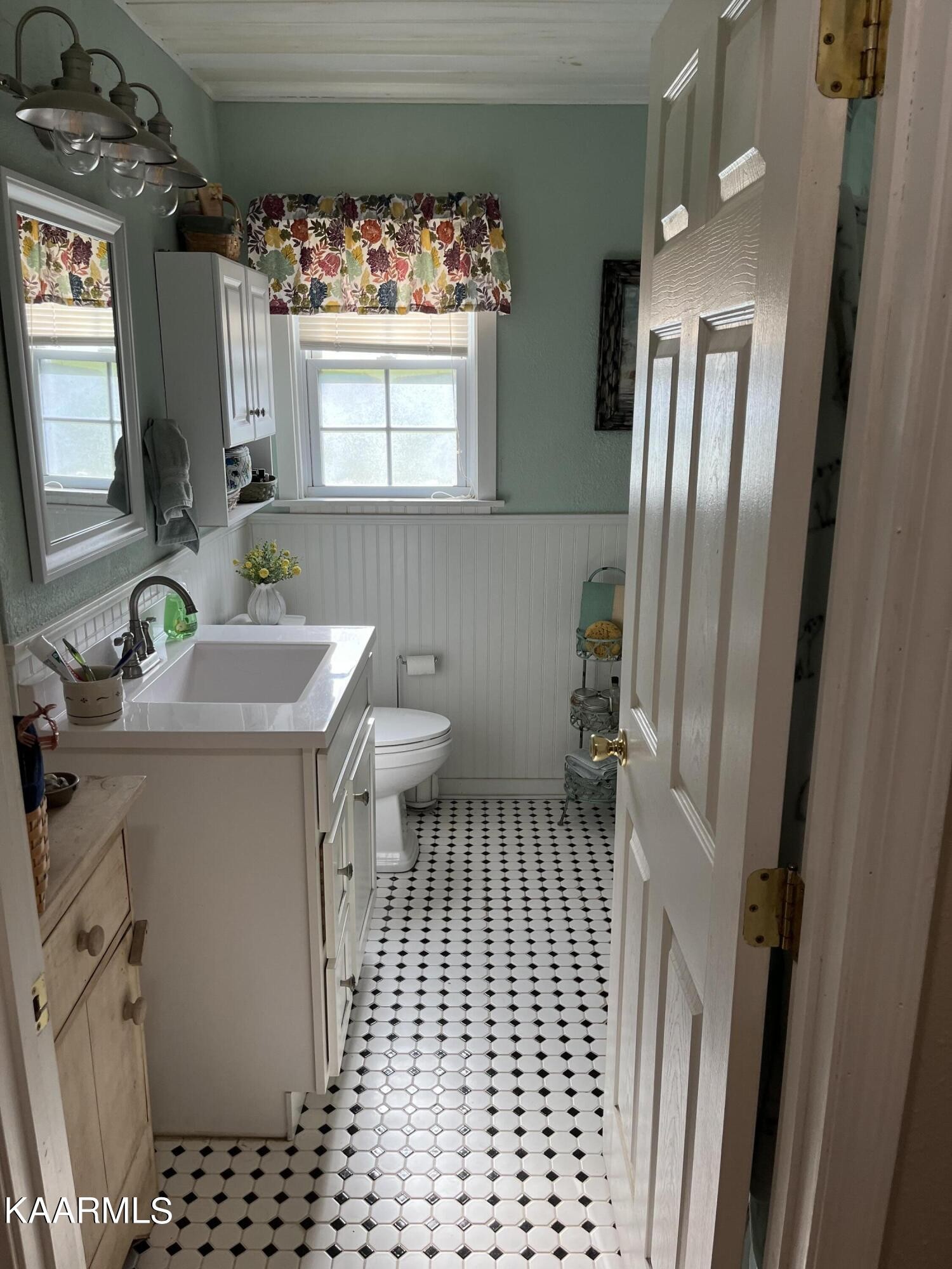 4700 Sunnyside Road Philadelphia, TN 37846 - Photo 13 of 48 a bathroom with a sink a toilet a window and vanity