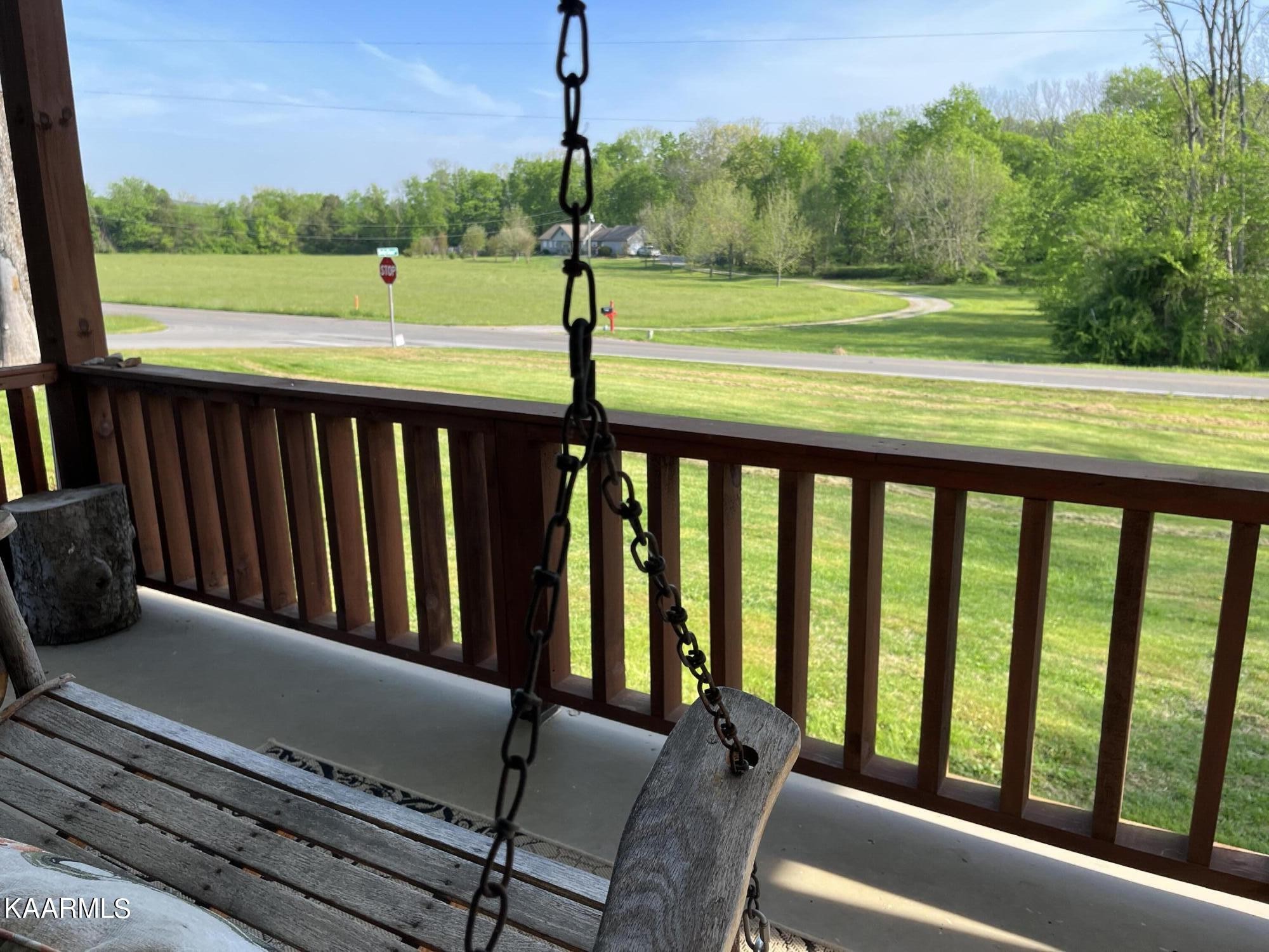 4700 Sunnyside Road Philadelphia, TN 37846 - Photo 17 of 48 a balcony with view of trees in the background