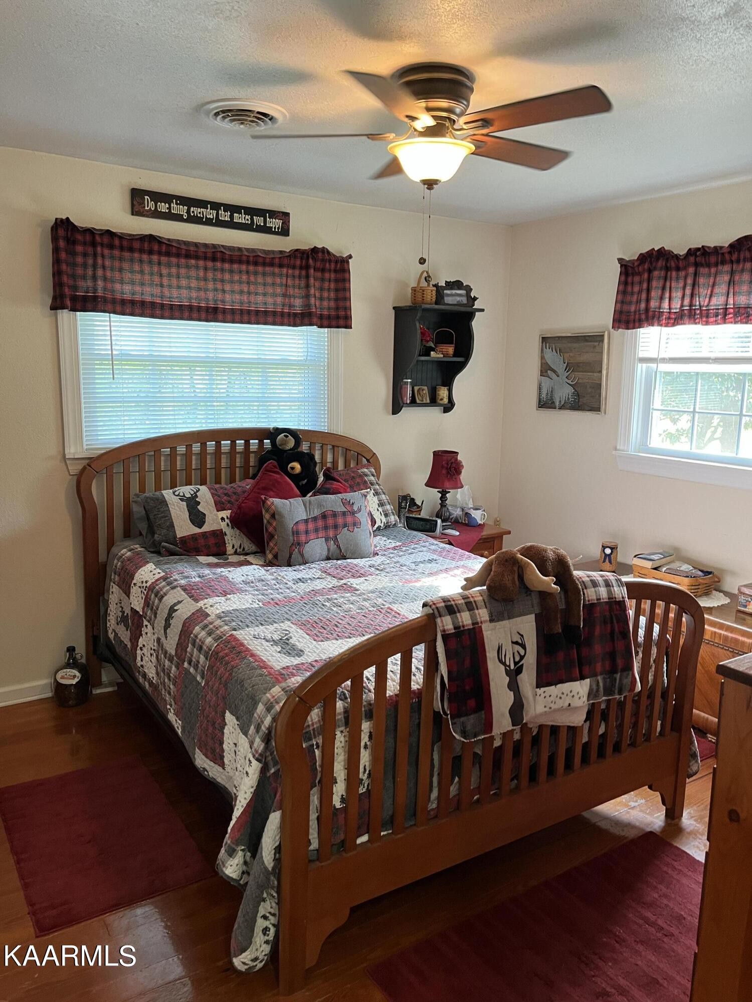 4700 Sunnyside Road Philadelphia, TN 37846 - Photo 20 of 48 a bedroom with a bed and a chandelier