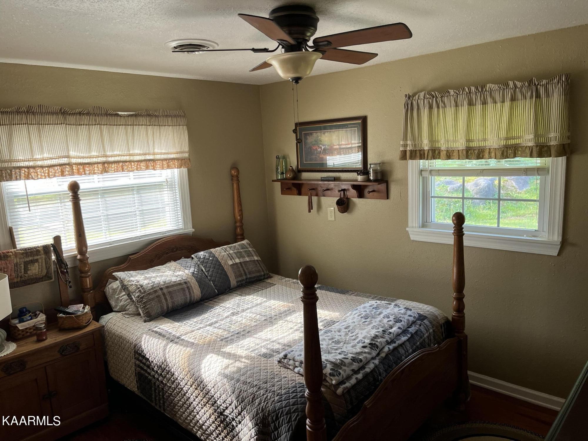 4700 Sunnyside Road Philadelphia, TN 37846 - Photo 21 of 48 a bedroom with a bed and a flat screen tv