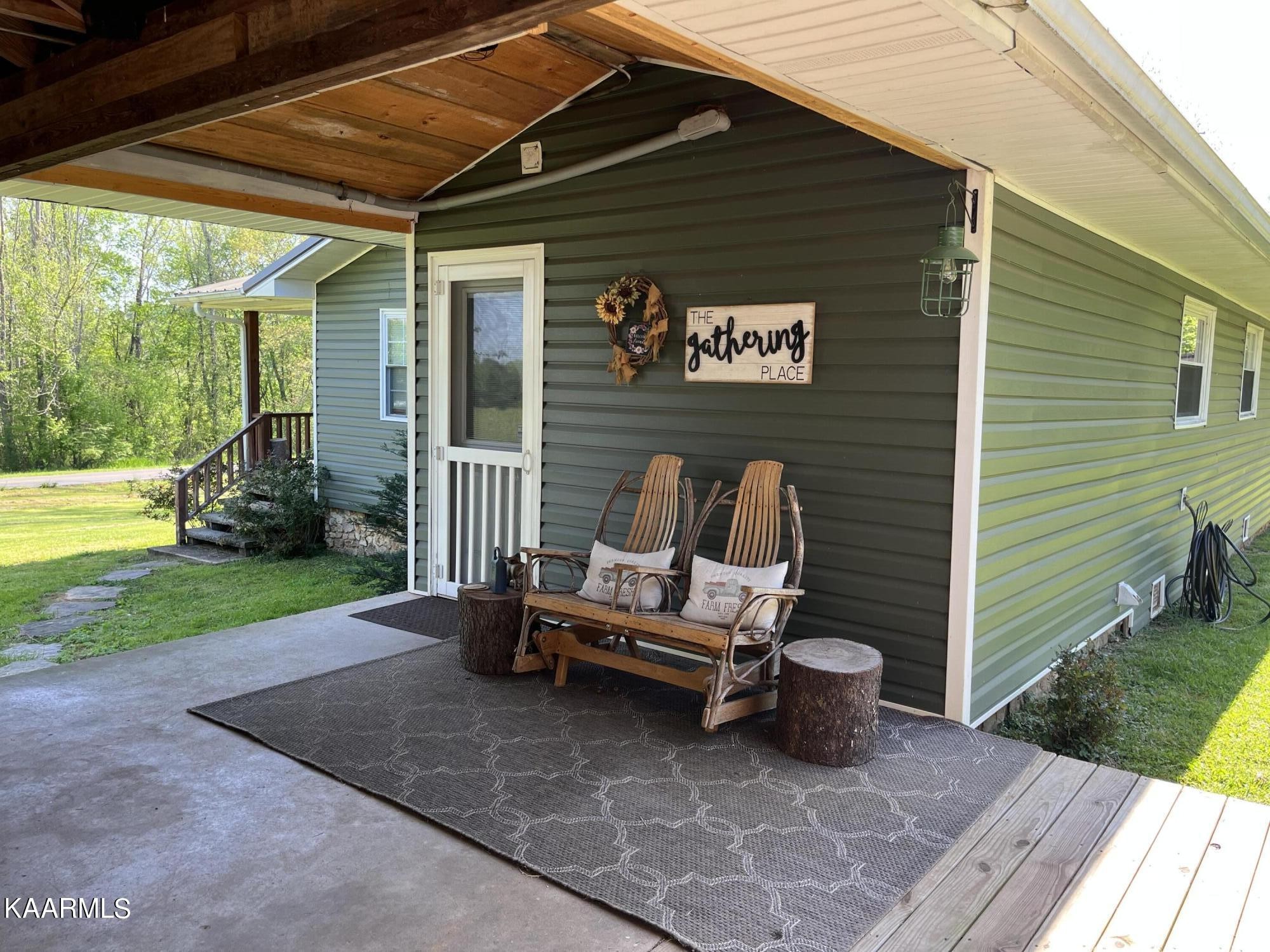 4700 Sunnyside Road Philadelphia, TN 37846 - Photo 23 of 48 a backyard of a house with seating space