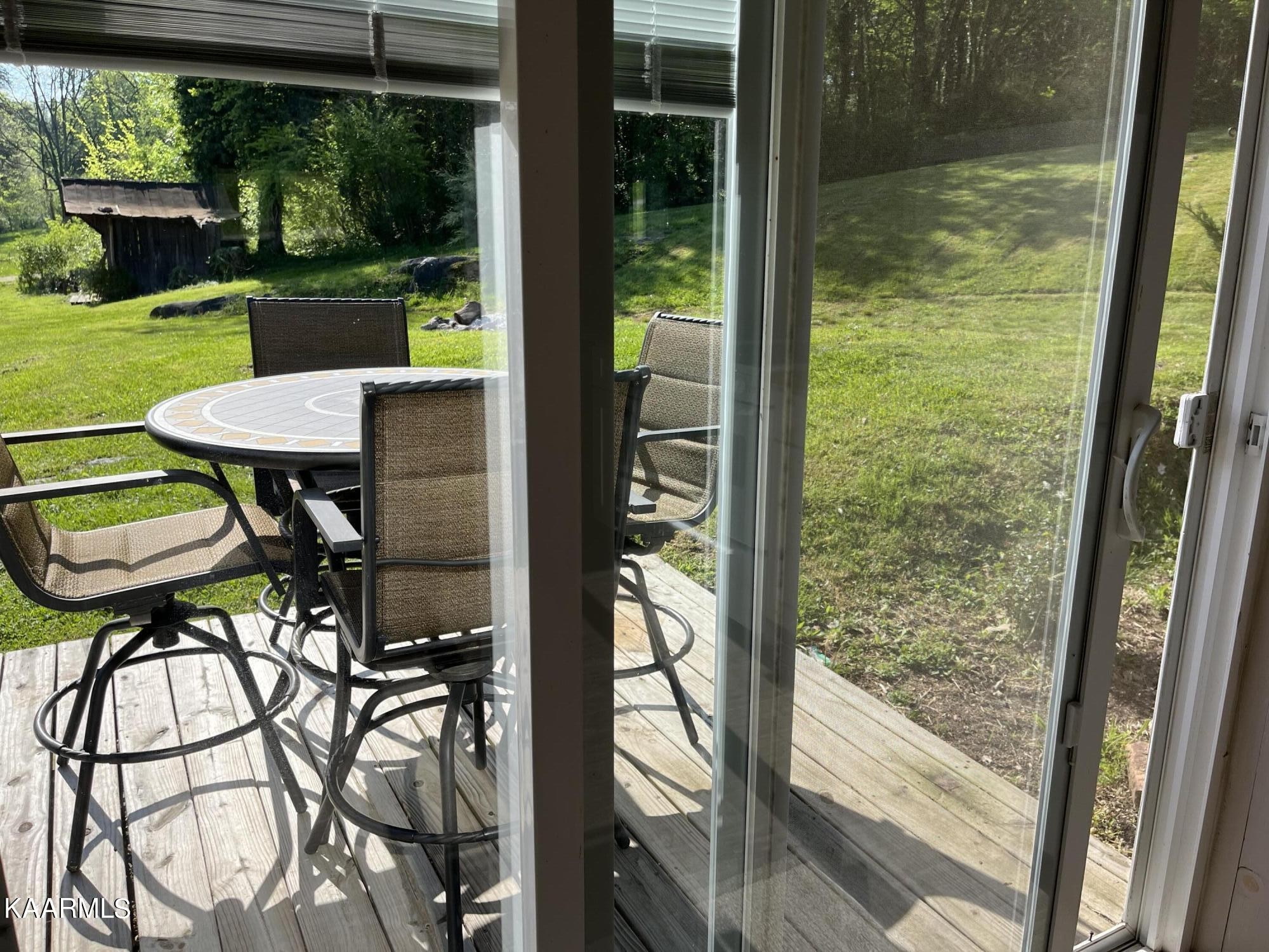 4700 Sunnyside Road Philadelphia, TN 37846 - Photo 34 of 48 a balcony view with a couple of chairs and a table