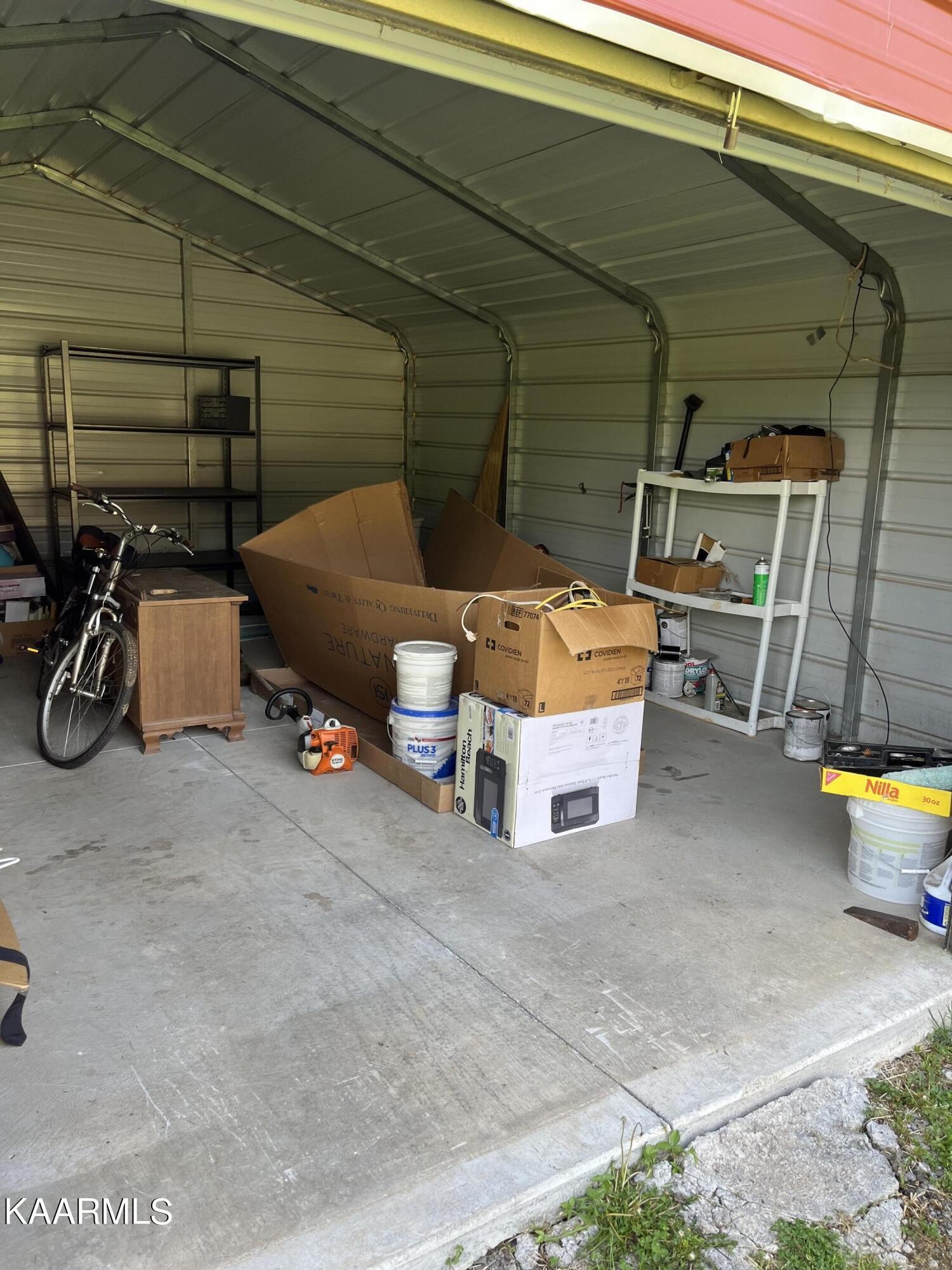 4700 Sunnyside Road Philadelphia, TN 37846 - Photo 42 of 48 a view of a garage with parked cars