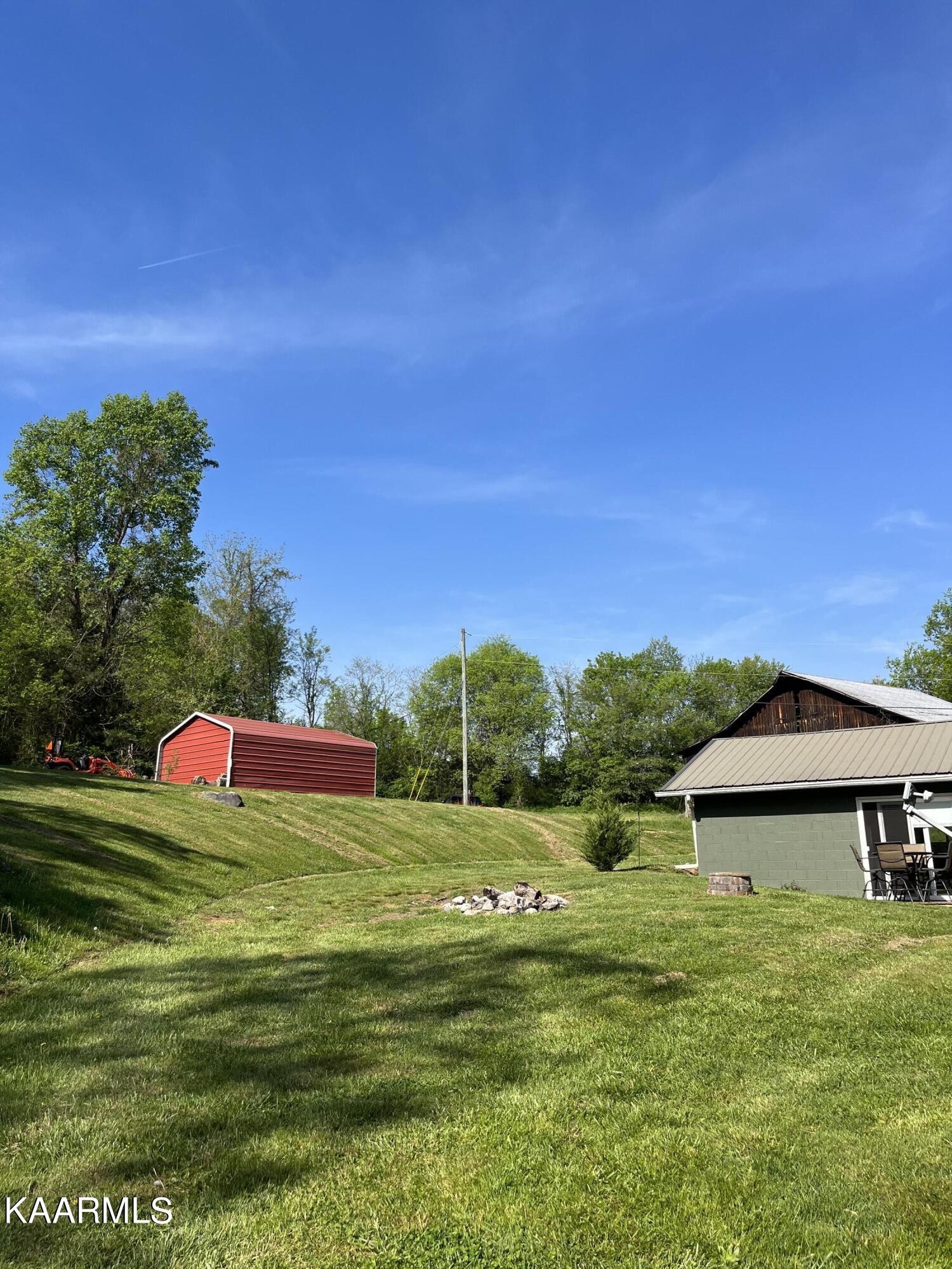 4700 Sunnyside Road Philadelphia, TN 37846 - Photo 43 of 48 a view of a green field with an empty room