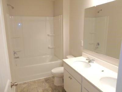 177 Valley View Circle Dallas, GA 30132 - Photo 15 of 23 a bathroom with a sink a toilet and shower