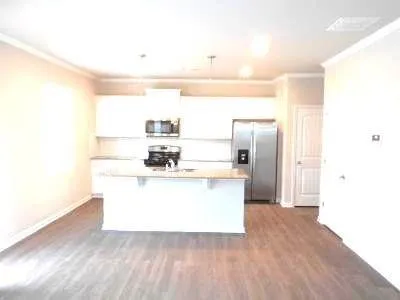 a view of kitchen with wooden floor