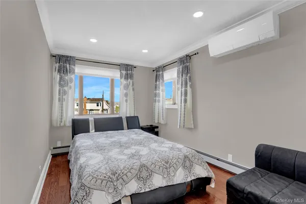 a bedroom with a bed and a couch