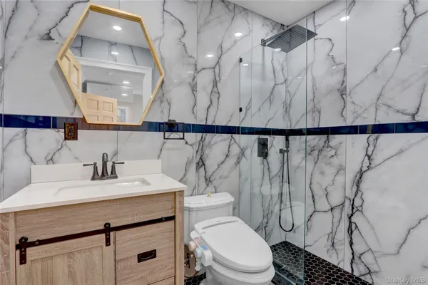 a bathroom with a sink toilet and shower