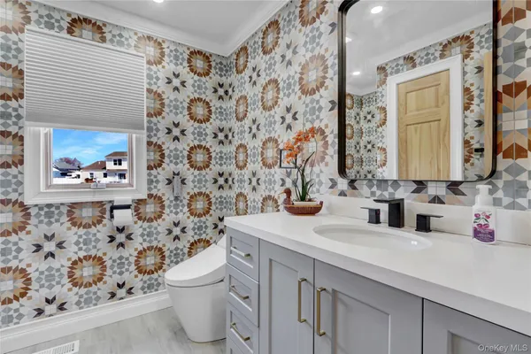 a view of a lake with a table and chairs