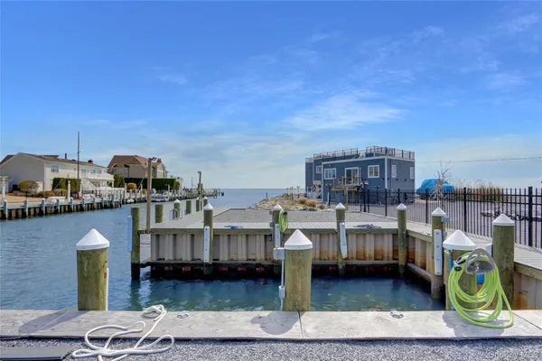 a view of a chairs and table on the wooden floor