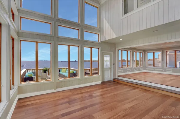 a view of a dining room with large windows