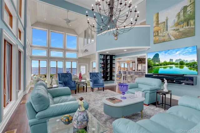 a bedroom with a large bed and a view of kitchen